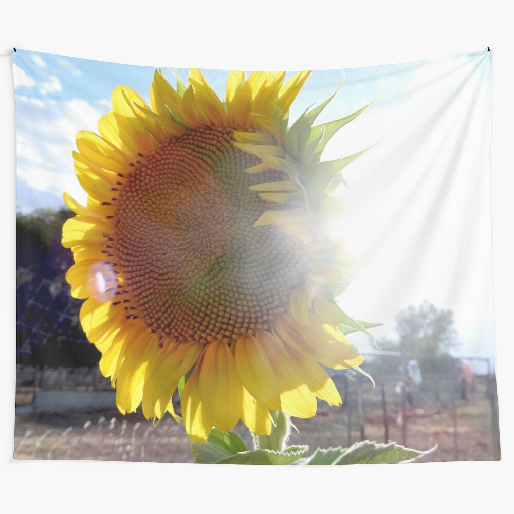 A beautiful tapestry showcasing a giant sunflower against a vibrant blue sky background