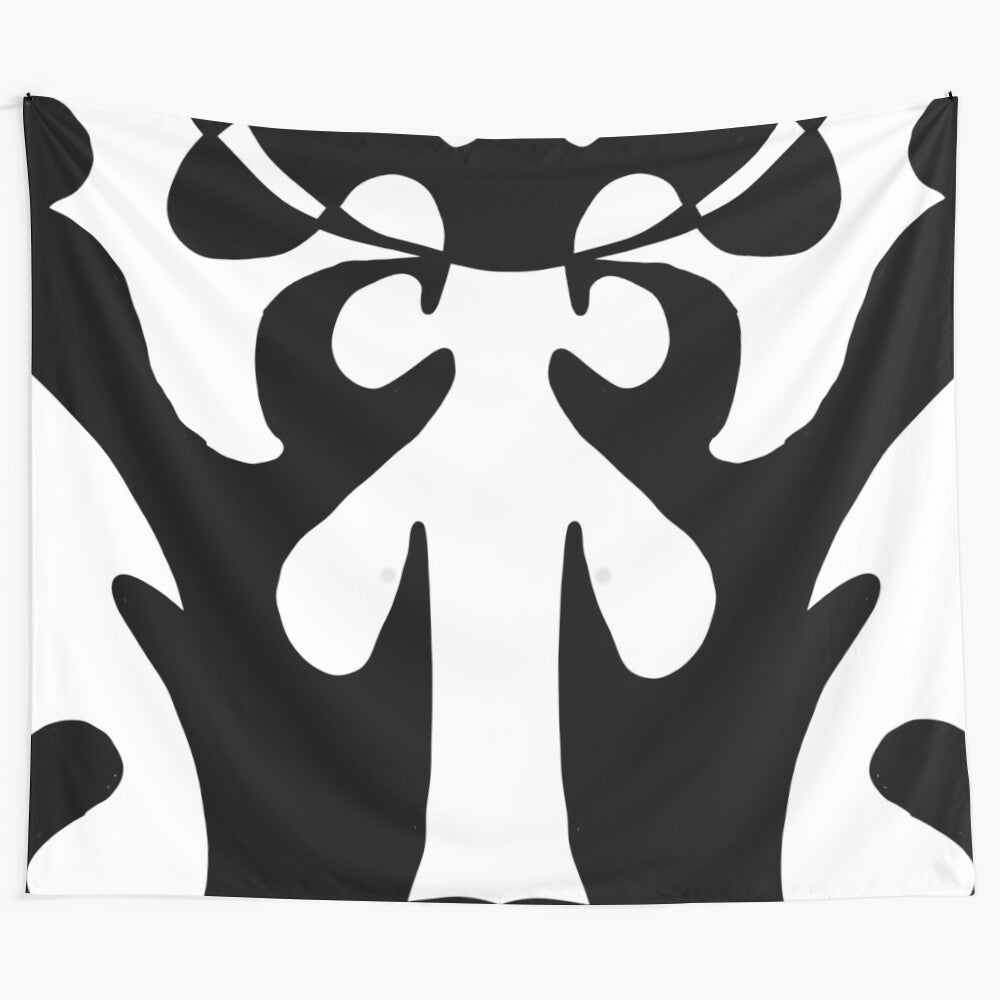 Minimalist black and white tapestry with abstract repeating geometric shapes