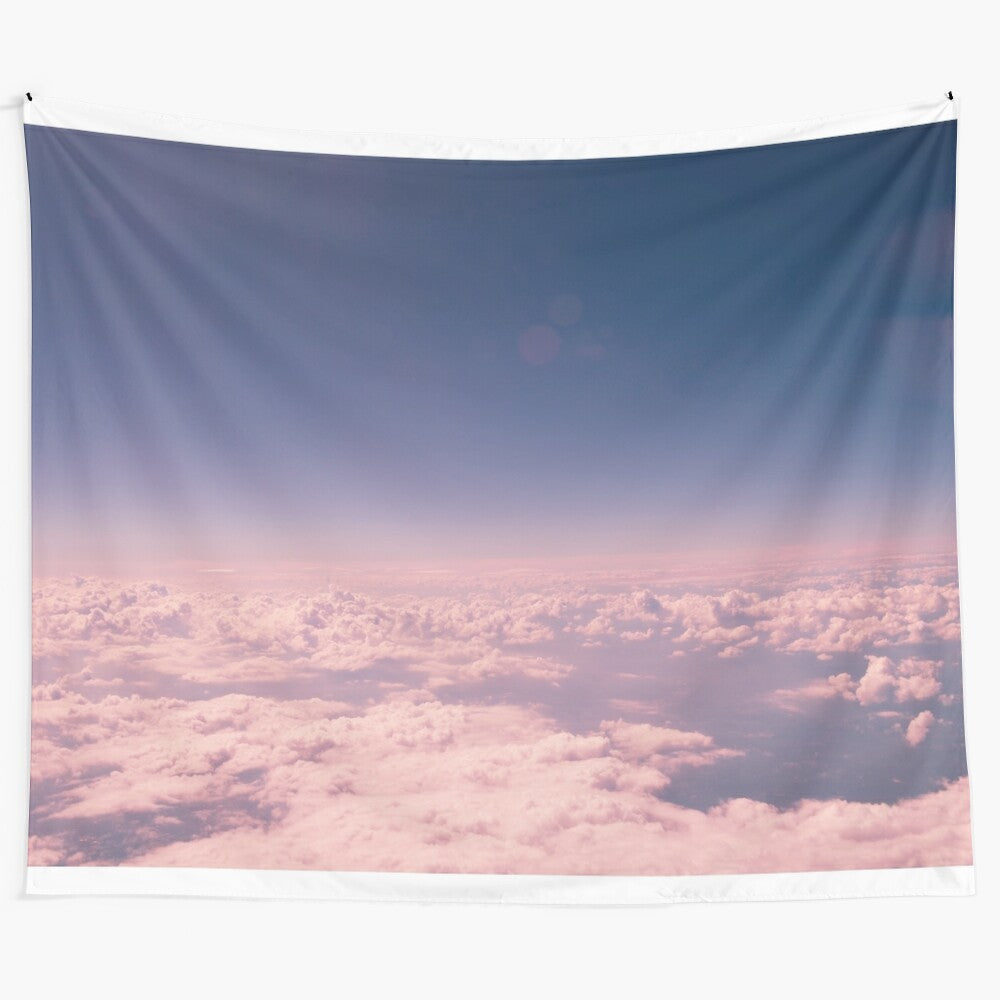 Pink clouds tapestry with blue sky and airplane