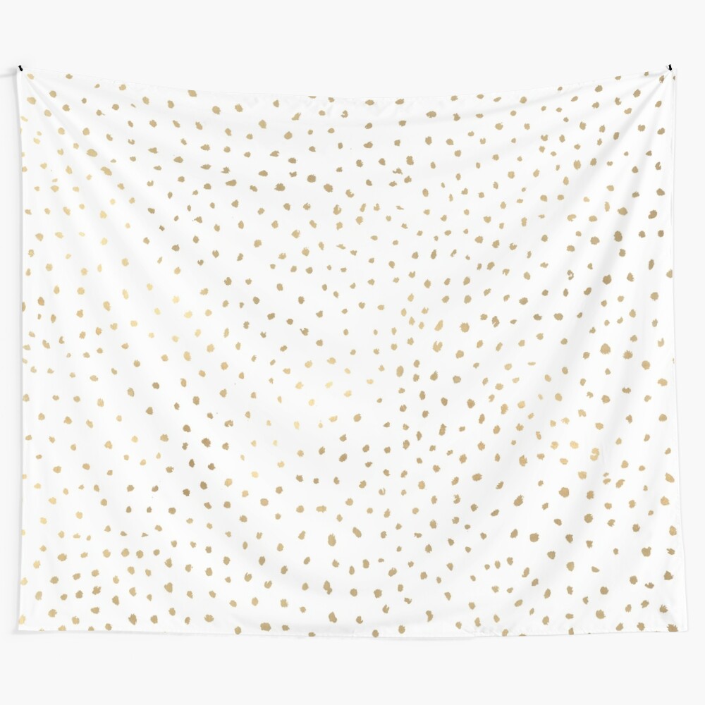 Dotted gold and white tapestry with an abstract, modern pattern