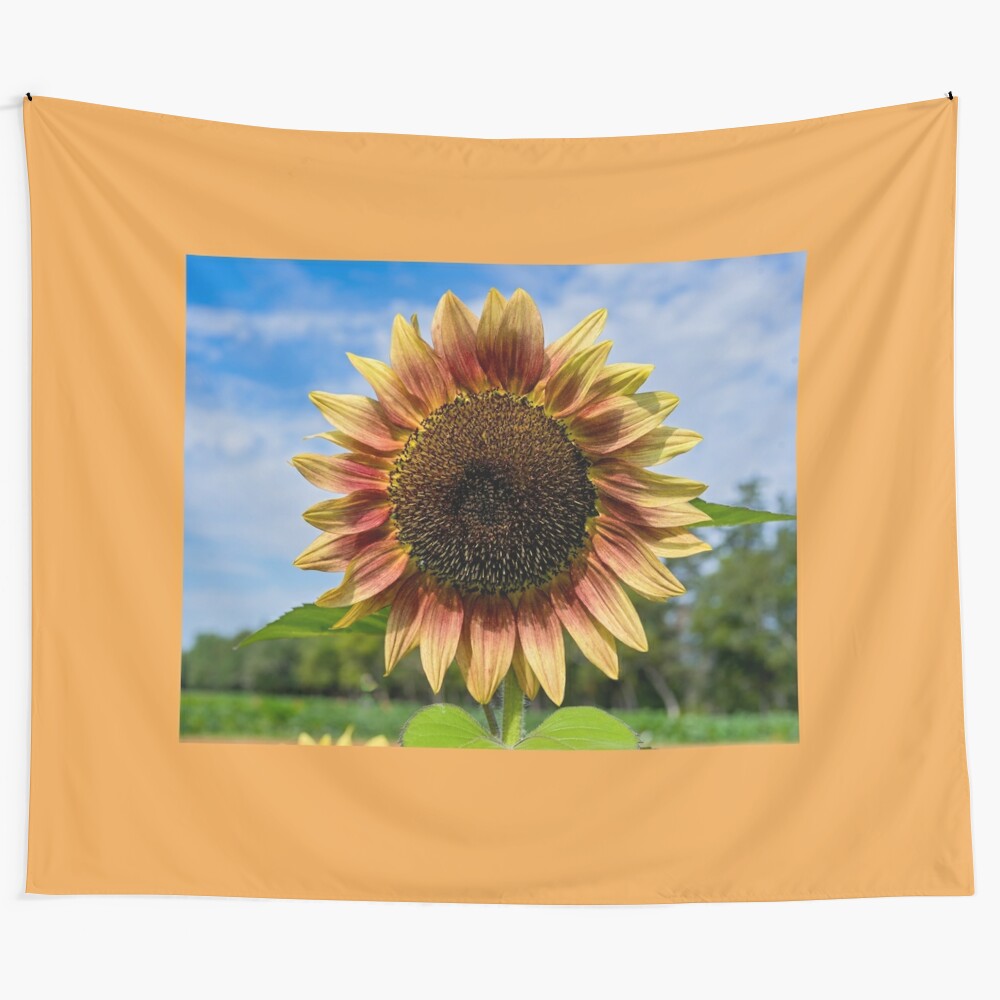 Sunflower tapestry showcasing a vibrant field of yellow and red sunflowers