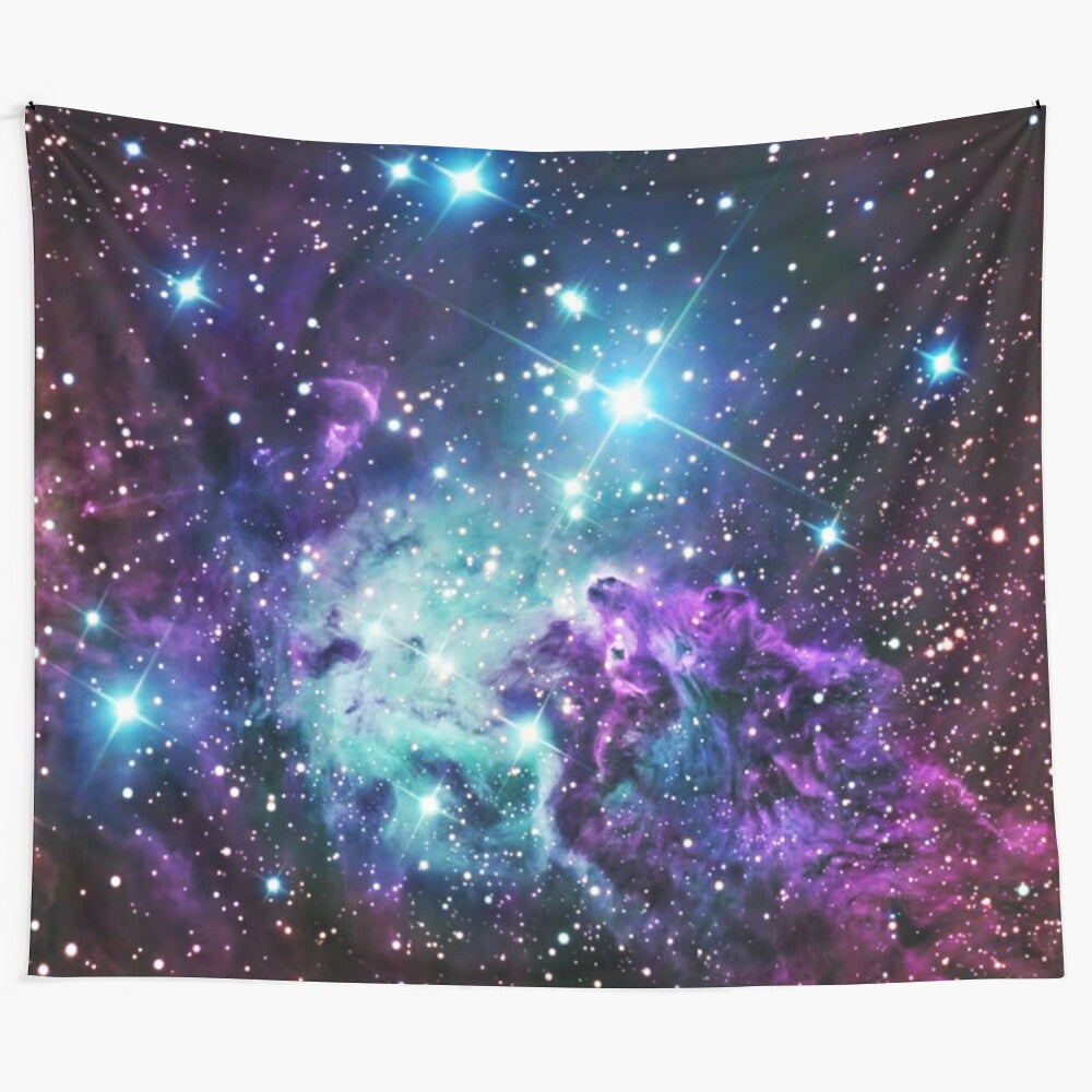 Cosmic nebula tapestry featuring teal, turquoise, and purple hues depicting a galaxy scene