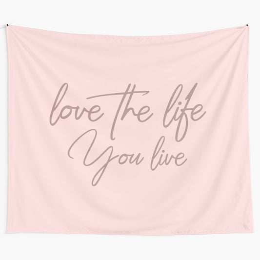 Baby pink tapestry with inspirational quote "Love the life you live"