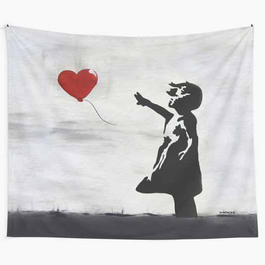 Banksy-inspired graffiti art of girl with heart balloon