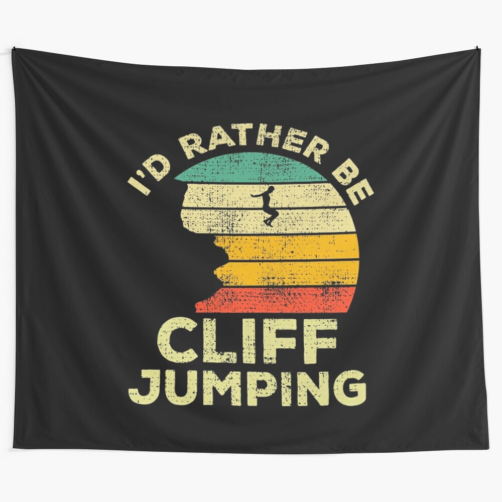 Vintage-style tapestry featuring the text "I'd Rather Be Cliff Jumping" with images of cliff jumping and extreme sports