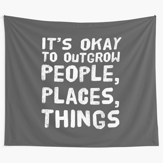 Tapestry with the message "It's Okay to Outgrow People, Places, and Things"