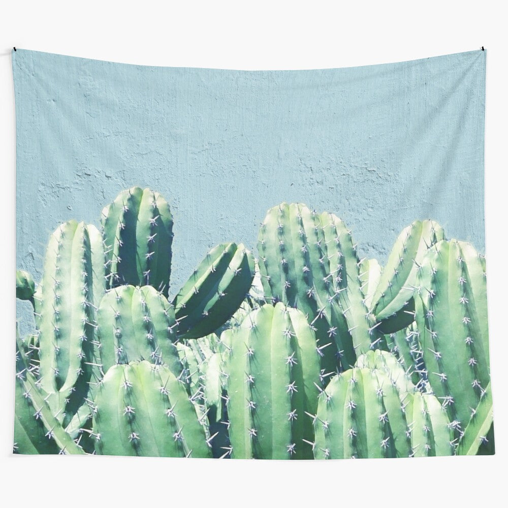 Cactus and Teal Tapestry featuring a nature-inspired collage design