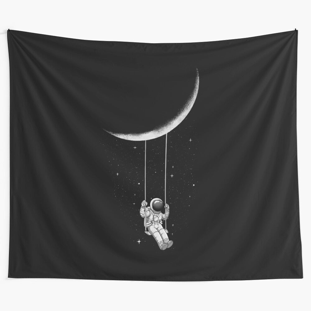 Surreal black and white tapestry depicting a moon-shaped swing in a cosmic, abstract landscape