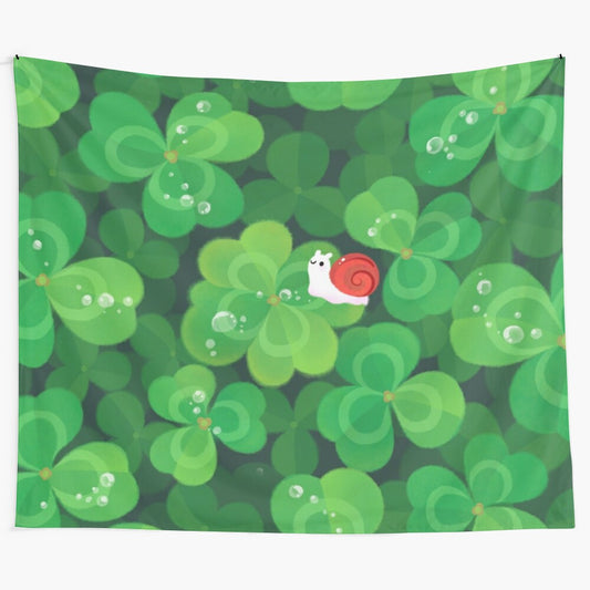 A colorful tapestry featuring a happy, lucky snail surrounded by leafy plants and a 4-leaf clover