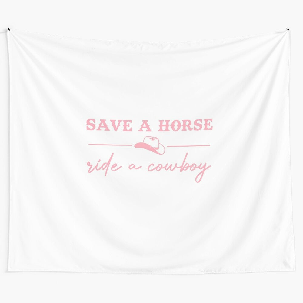 "Save a Horse, Ride a Cowboy" tapestry featuring a pink cowboy aesthetic