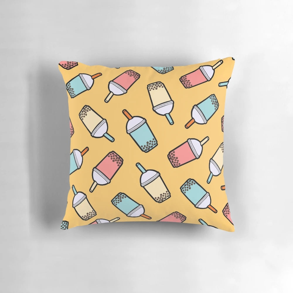 Decorative pillow featuring a colorful bubble tea pattern with taro balls and bubbles.