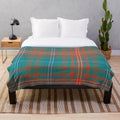 Tartan-style plaid plush blanket in green and blue colors