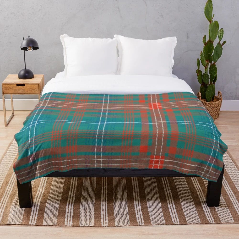 Tartan-style plaid plush blanket in green and blue colors