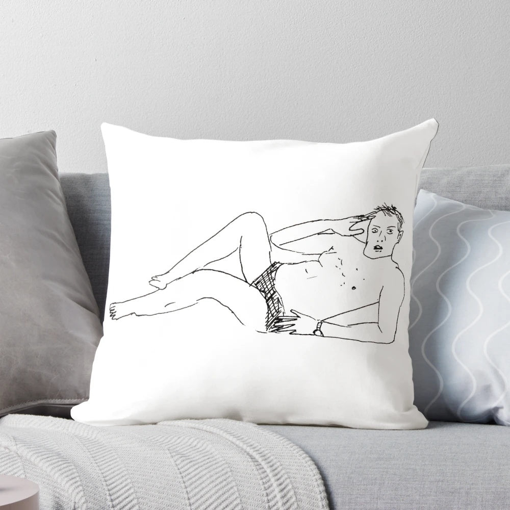 A colorful and whimsical pillow featuring a poorly drawn illustration of Taskmaster host Greg Davies.