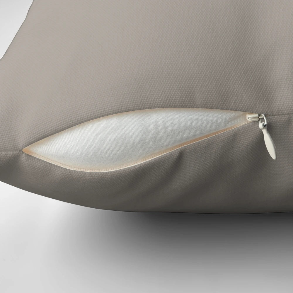 Taupe solid color pillow with a simple, minimalist abstract design inspired by nature