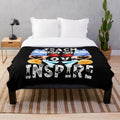 Plush blanket with "Teach, Love, Inspire" text design
