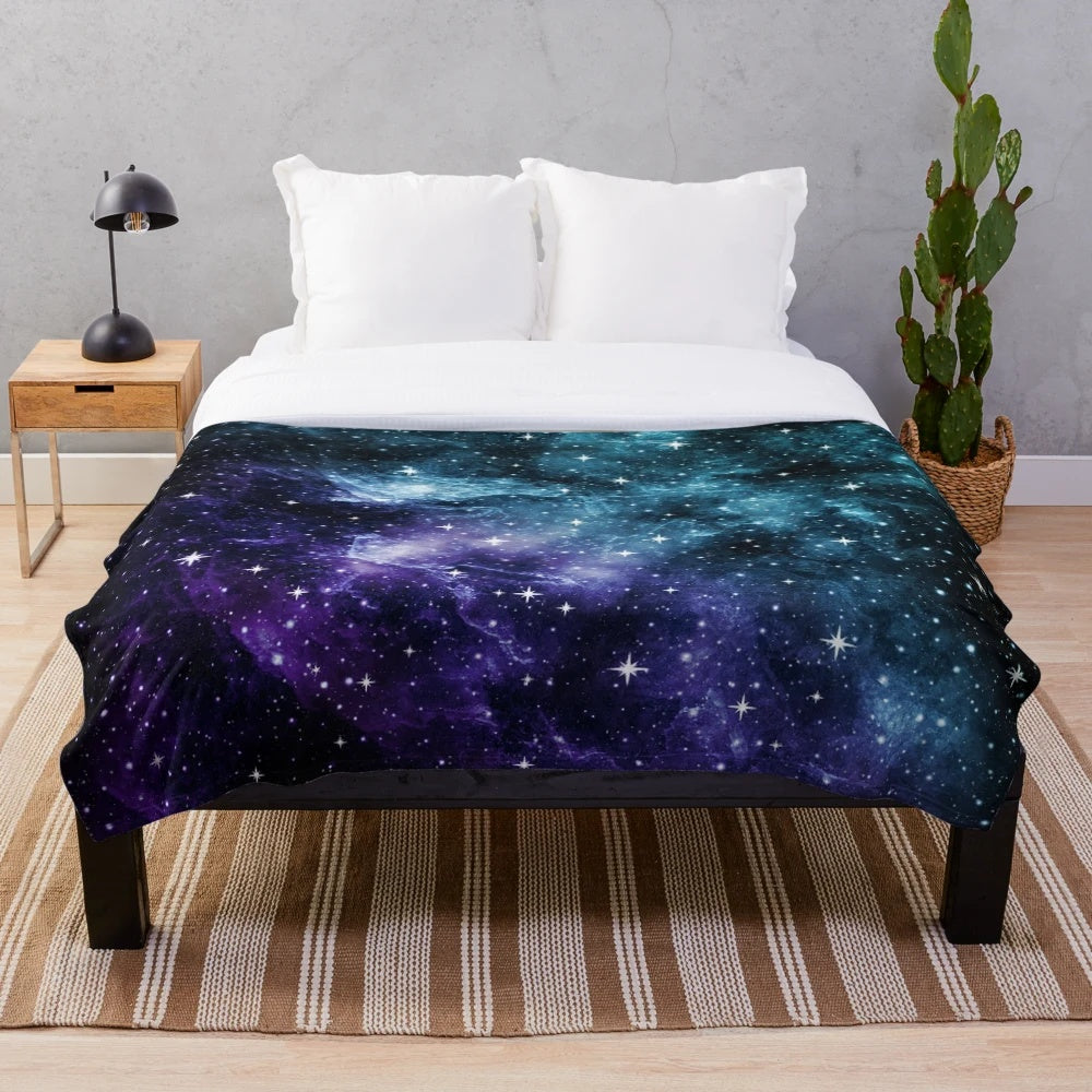Teal and purple galaxy nebula plush blanket with stars and cosmic design