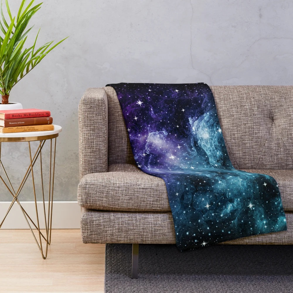 Teal and purple galaxy nebula plush blanket with stars and cosmic design
