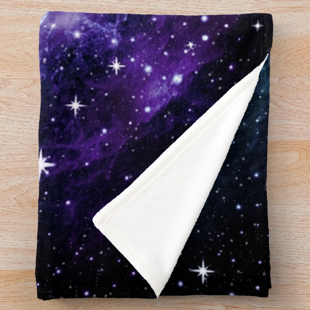Teal and purple galaxy nebula plush blanket with stars and cosmic design