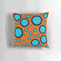 Teal, black and orange polka dot patterned throw pillow for home decor