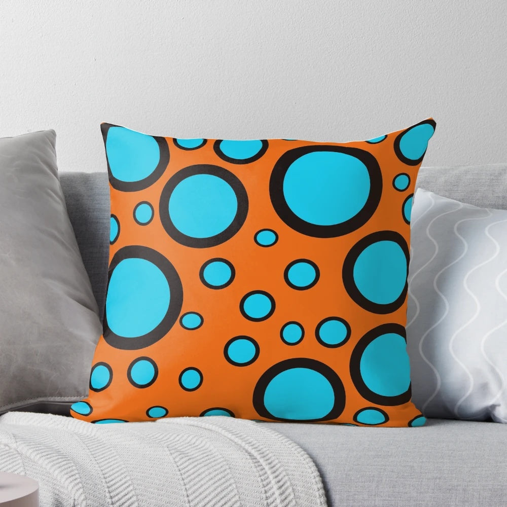 Teal, black and orange polka dot patterned throw pillow for home decor