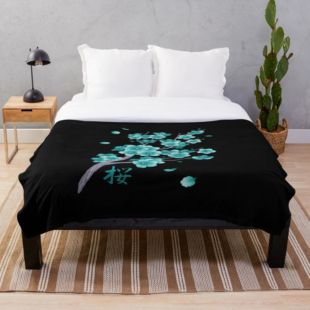 Teal blue sakura cherry blossom petals falling on a plush blanket