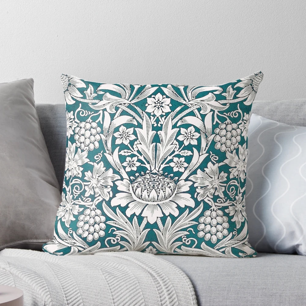 Teal blue and white floral leaves pattern pillow featuring a William Morris design