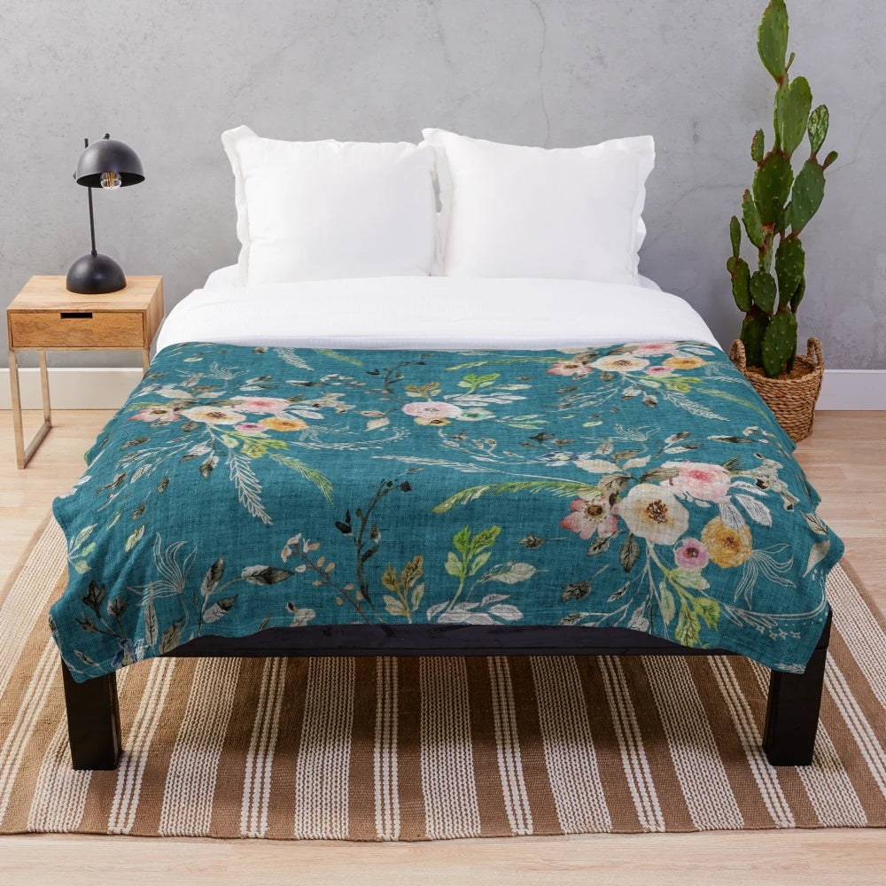 Teal floral plush blanket with romantic, bohemian-inspired design