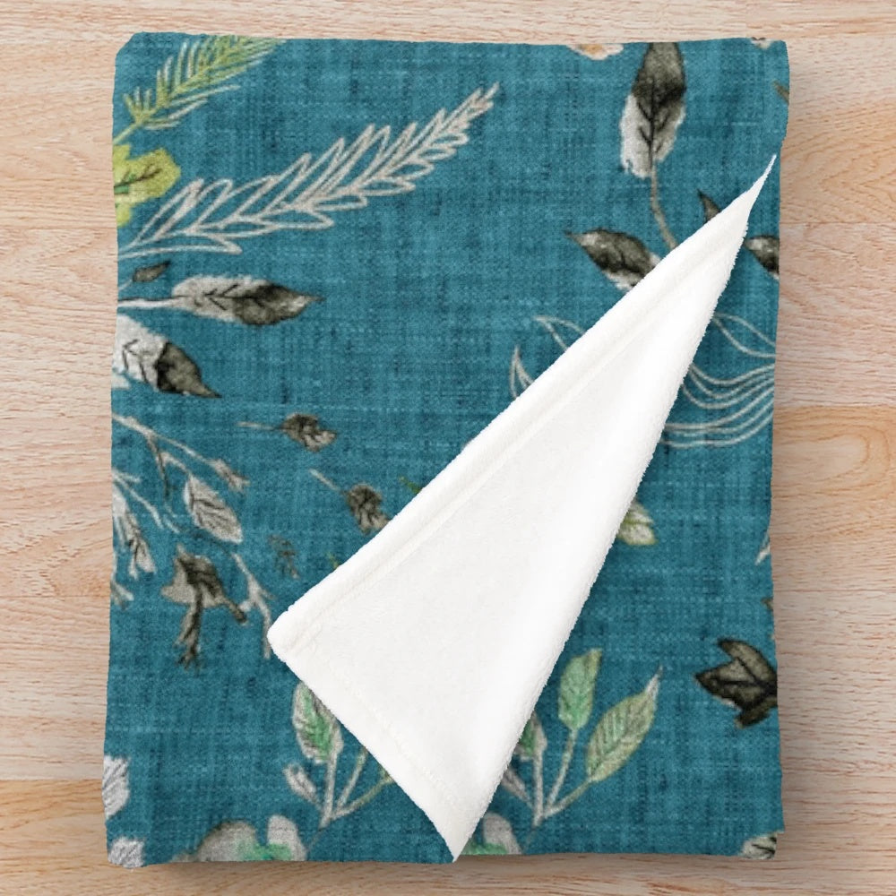 Teal floral plush blanket with romantic, bohemian-inspired design