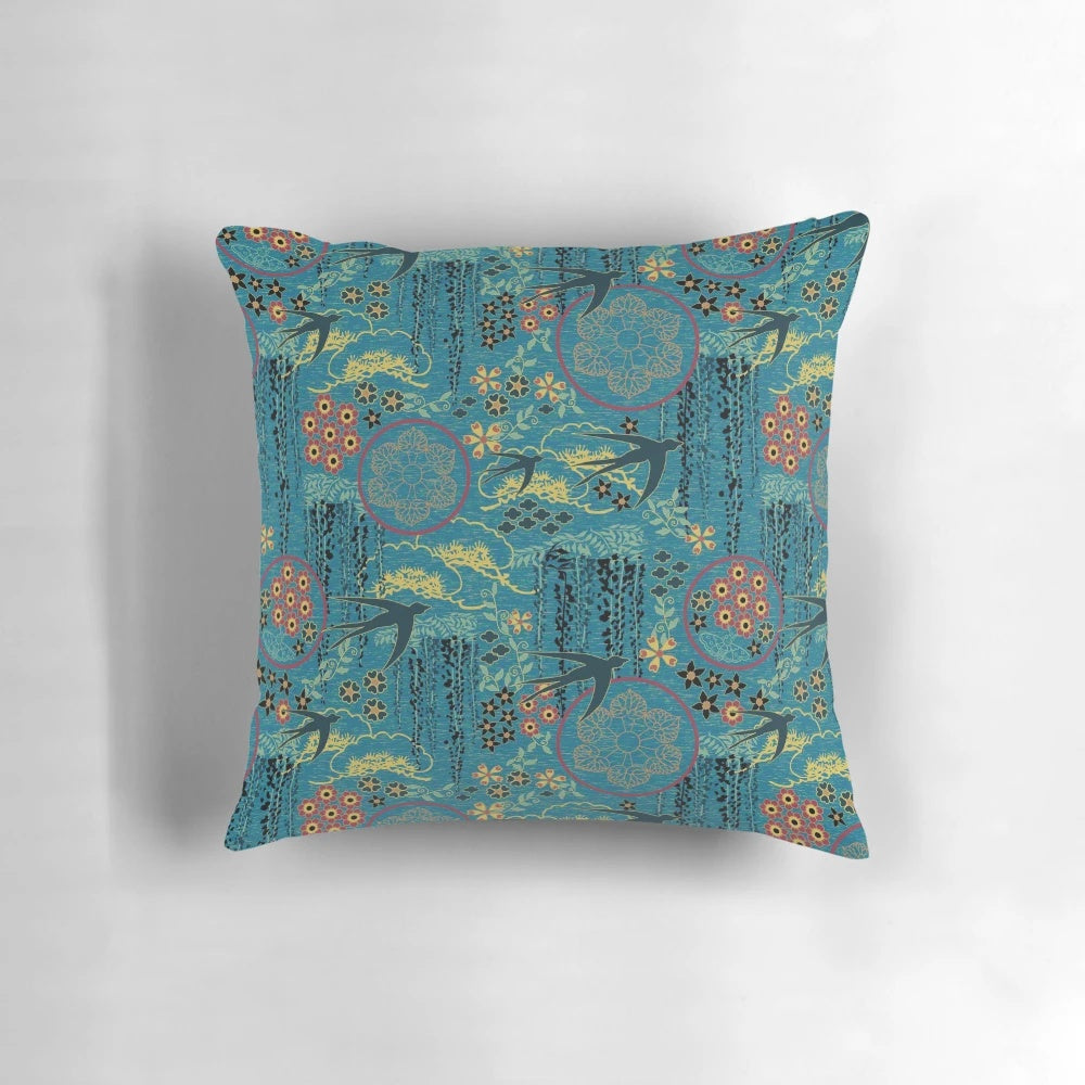 A beautiful teal, gold, and black throw pillow featuring a Japanese garden scene with flowers, birds, and silhouettes.