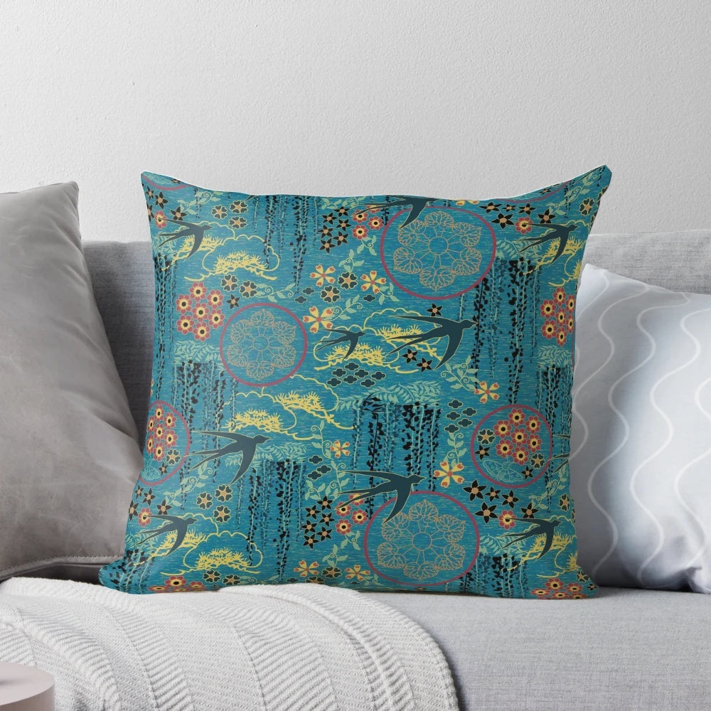 A beautiful teal, gold, and black throw pillow featuring a Japanese garden scene with flowers, birds, and silhouettes.