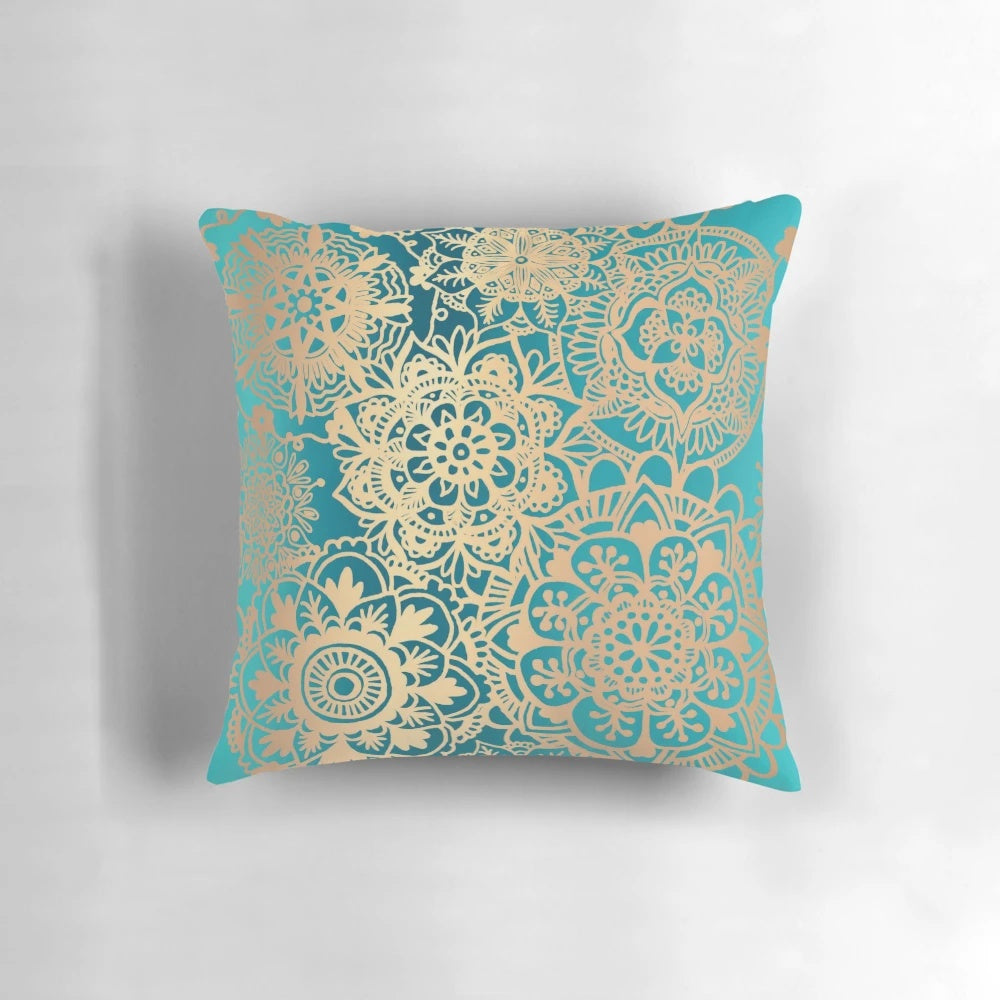 Teal green and gold mandala pattern decorative pillow with a bohemian, modern design.