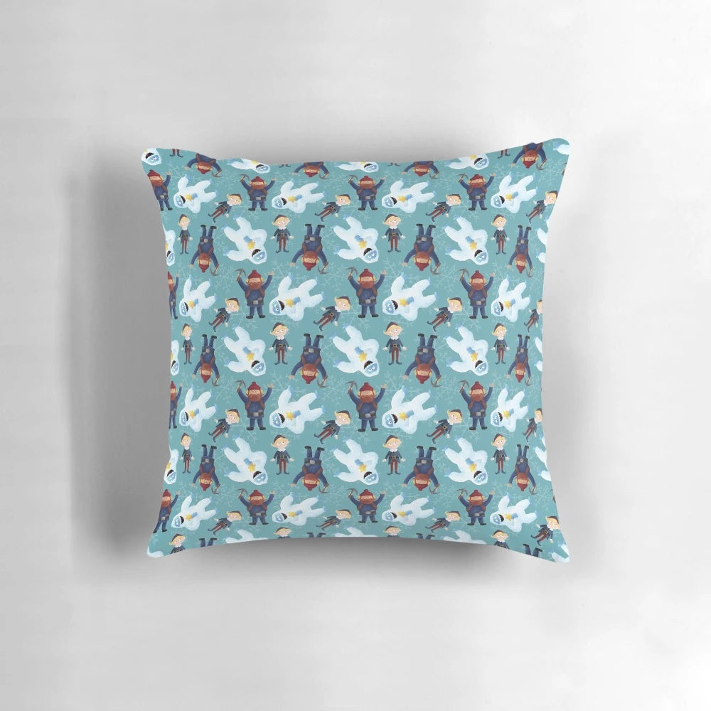 Teal pillow with a winter scene featuring Yukon Cornelius and the Abominable Snowman