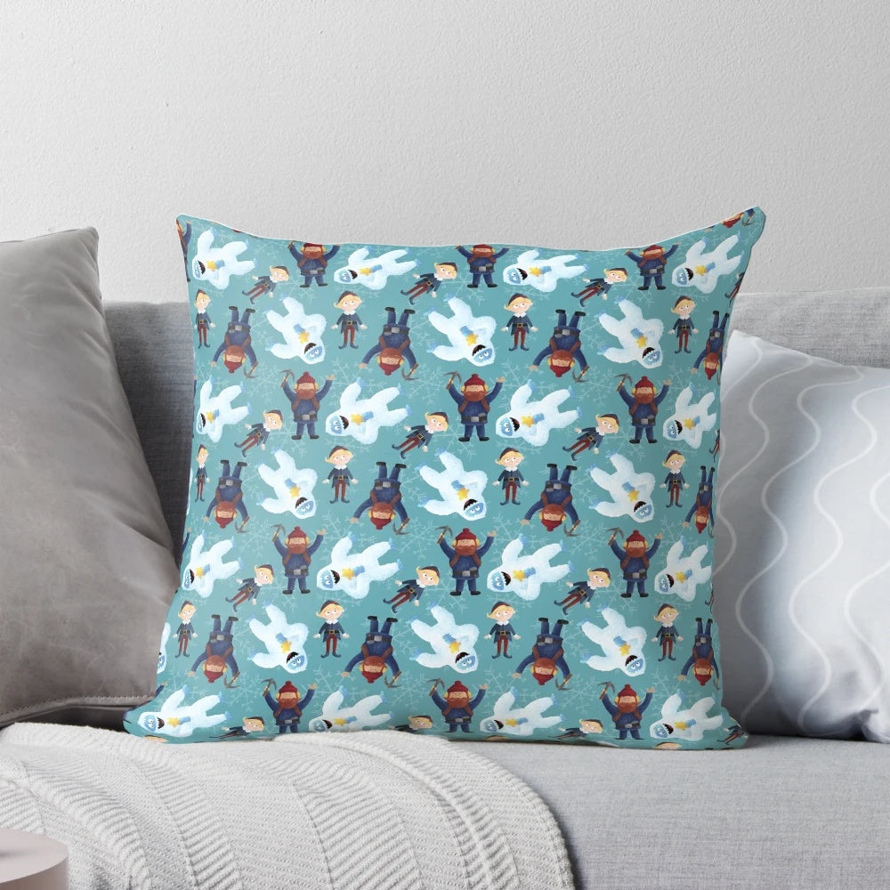 Teal pillow with a winter scene featuring Yukon Cornelius and the Abominable Snowman