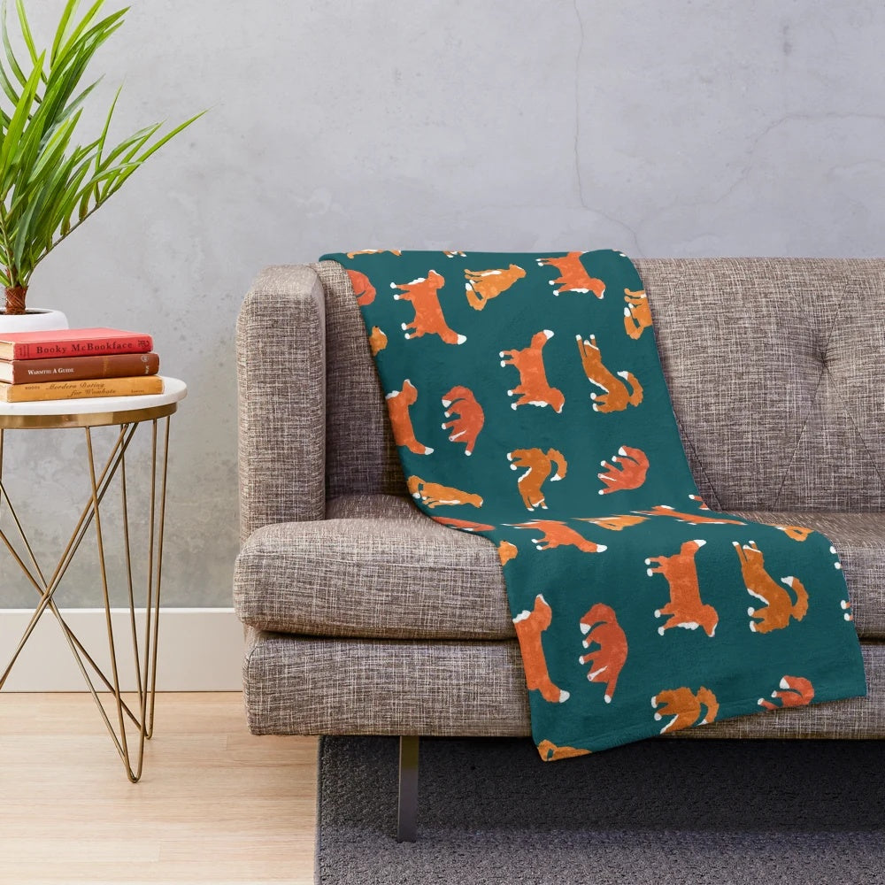 Teal plush blanket with abstract Nova Scotia duck tolling retriever silhouette