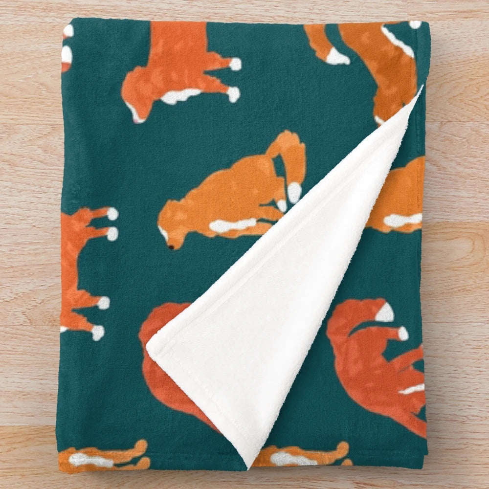Teal plush blanket with abstract Nova Scotia duck tolling retriever silhouette