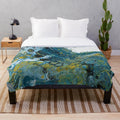 Teal plush blanket with abstract wave pattern