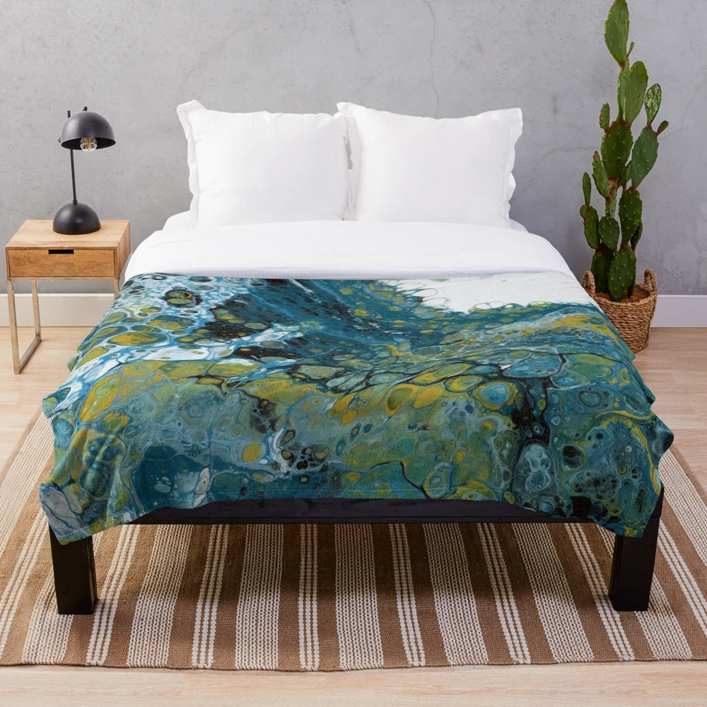 Teal plush blanket with abstract wave pattern
