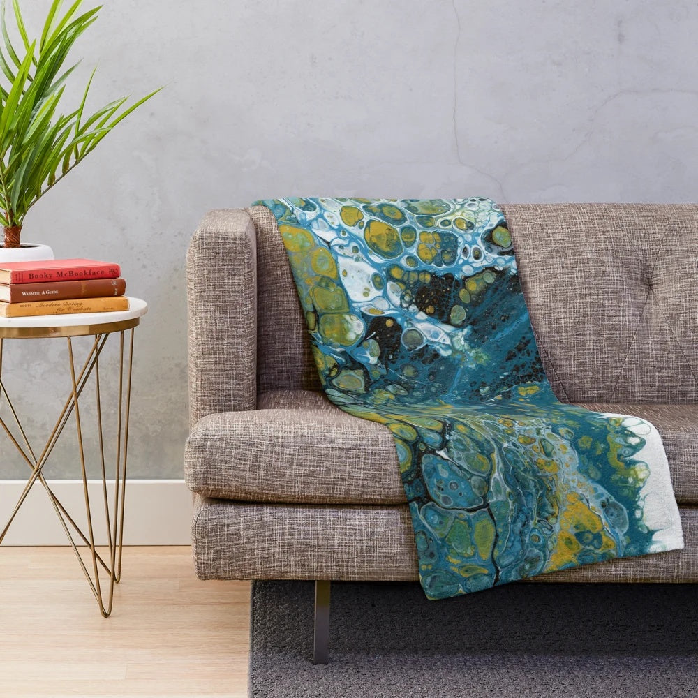 Teal plush blanket with abstract wave pattern