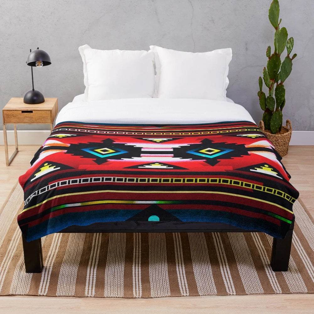 Teal plush blanket with tribal pattern and native american inspired geometric design