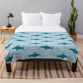 Teal shark-themed plush blanket with Blahaj-inspired design