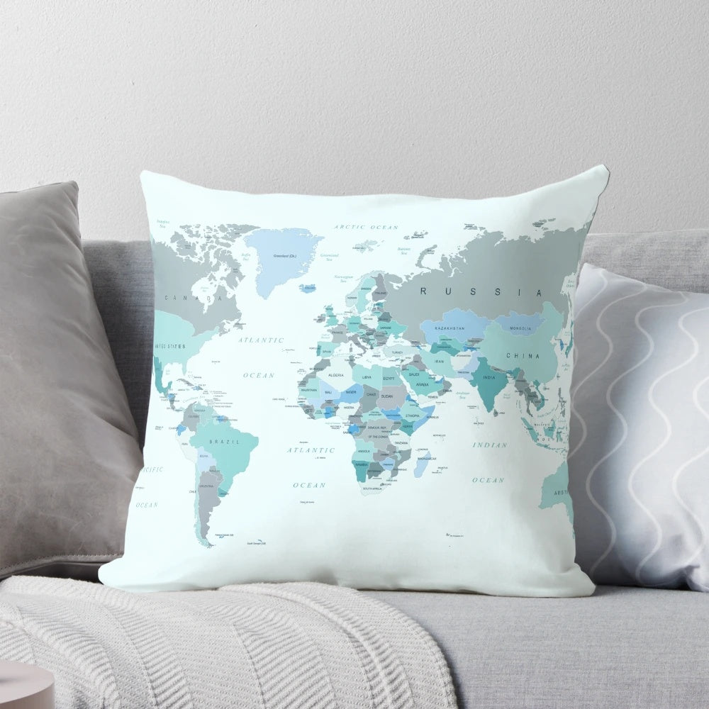 Teal and mint green world map printed on a soft, plush pillow for your home, office or dorm room.