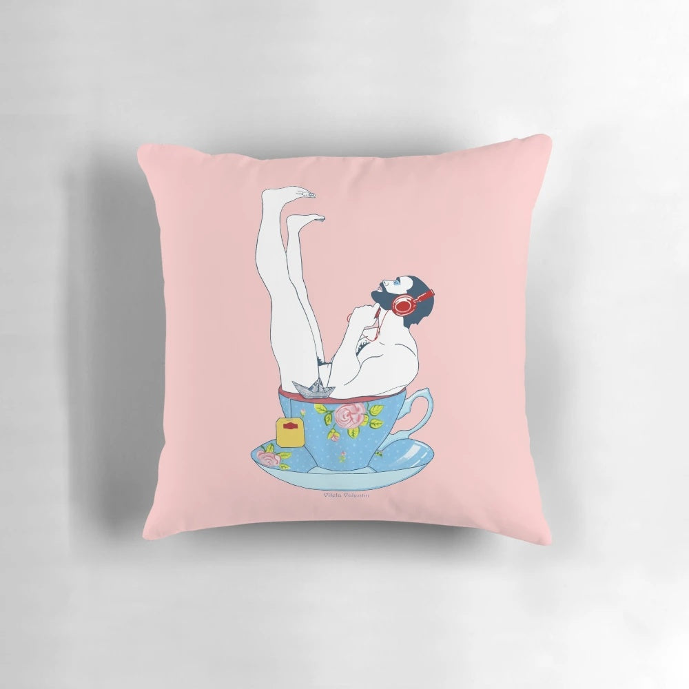 A soft, plush pillow featuring a stylish, bearded male figure holding a cup of tea, perfect for adding a touch of queer art to your home.