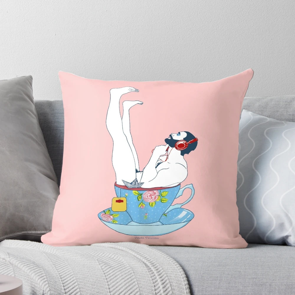 A soft, plush pillow featuring a stylish, bearded male figure holding a cup of tea, perfect for adding a touch of queer art to your home.