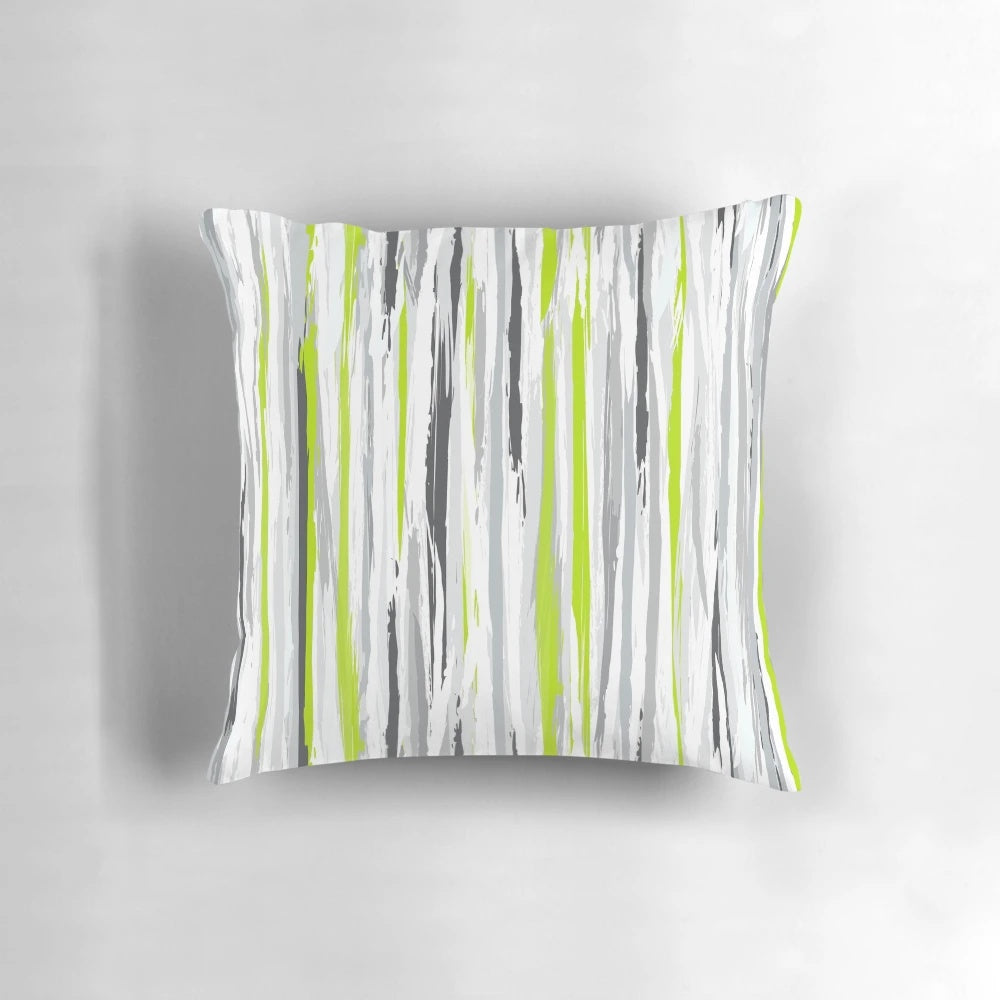 A stylish and textural striped pillow in shades of lime, grey, black, and white for a modern home decor accent.