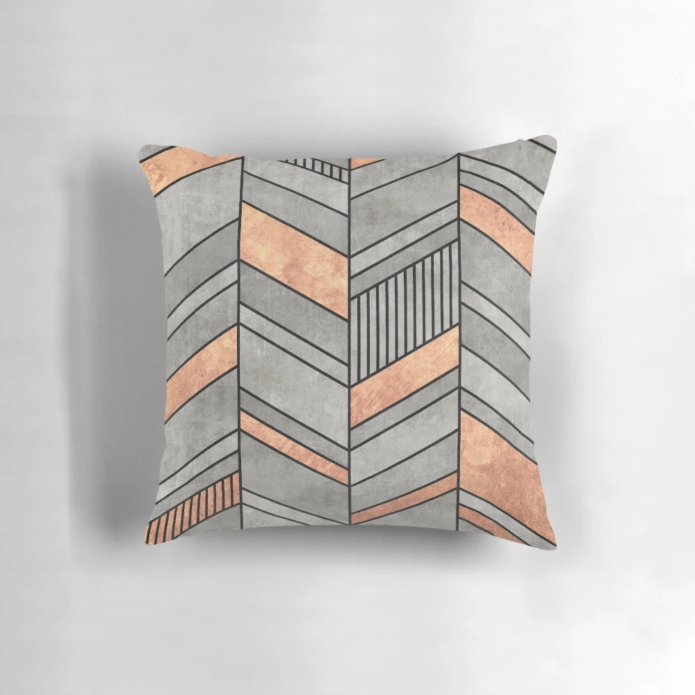 Chevron patterned throw pillow with concrete and copper textures