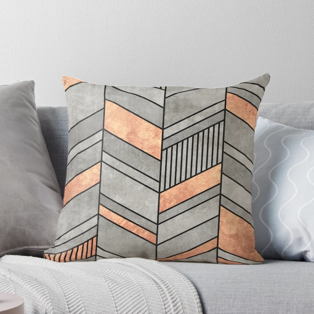 Chevron patterned throw pillow with concrete and copper textures