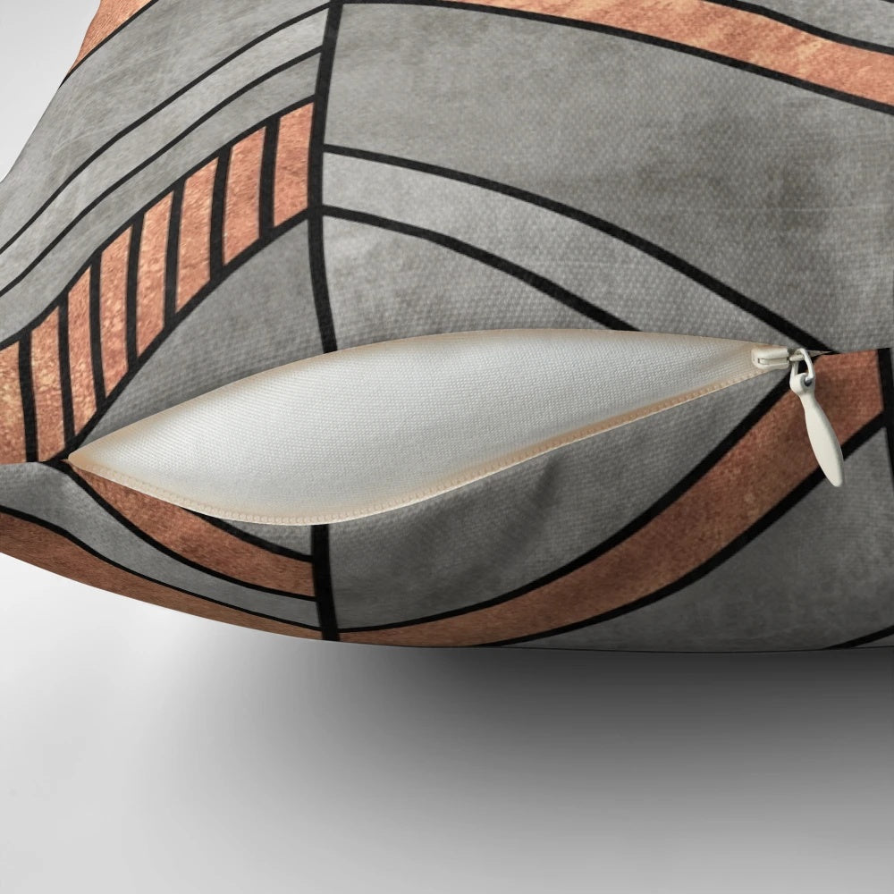 Chevron patterned throw pillow with concrete and copper textures