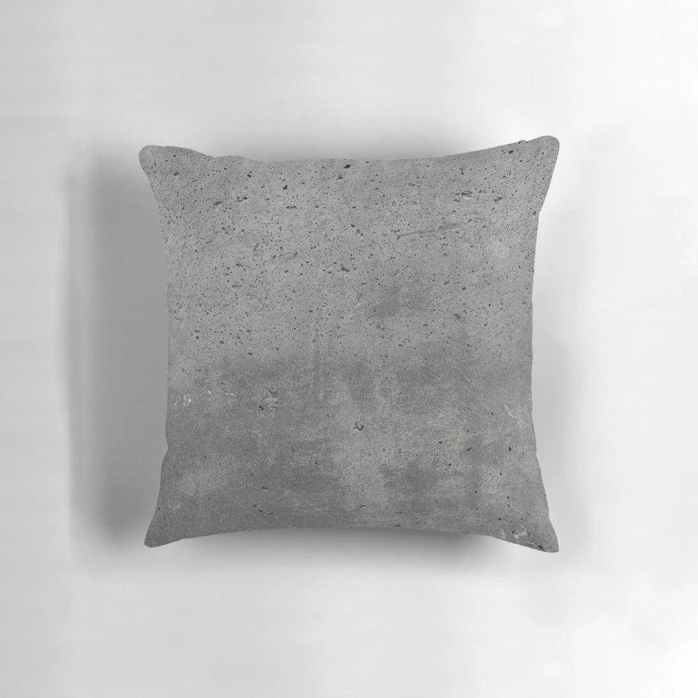 Textured grey concrete wall design pillow