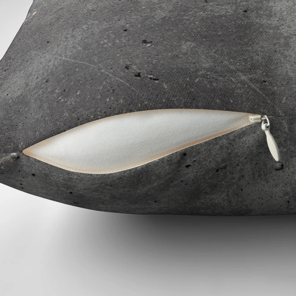 Textured grey concrete wall design pillow